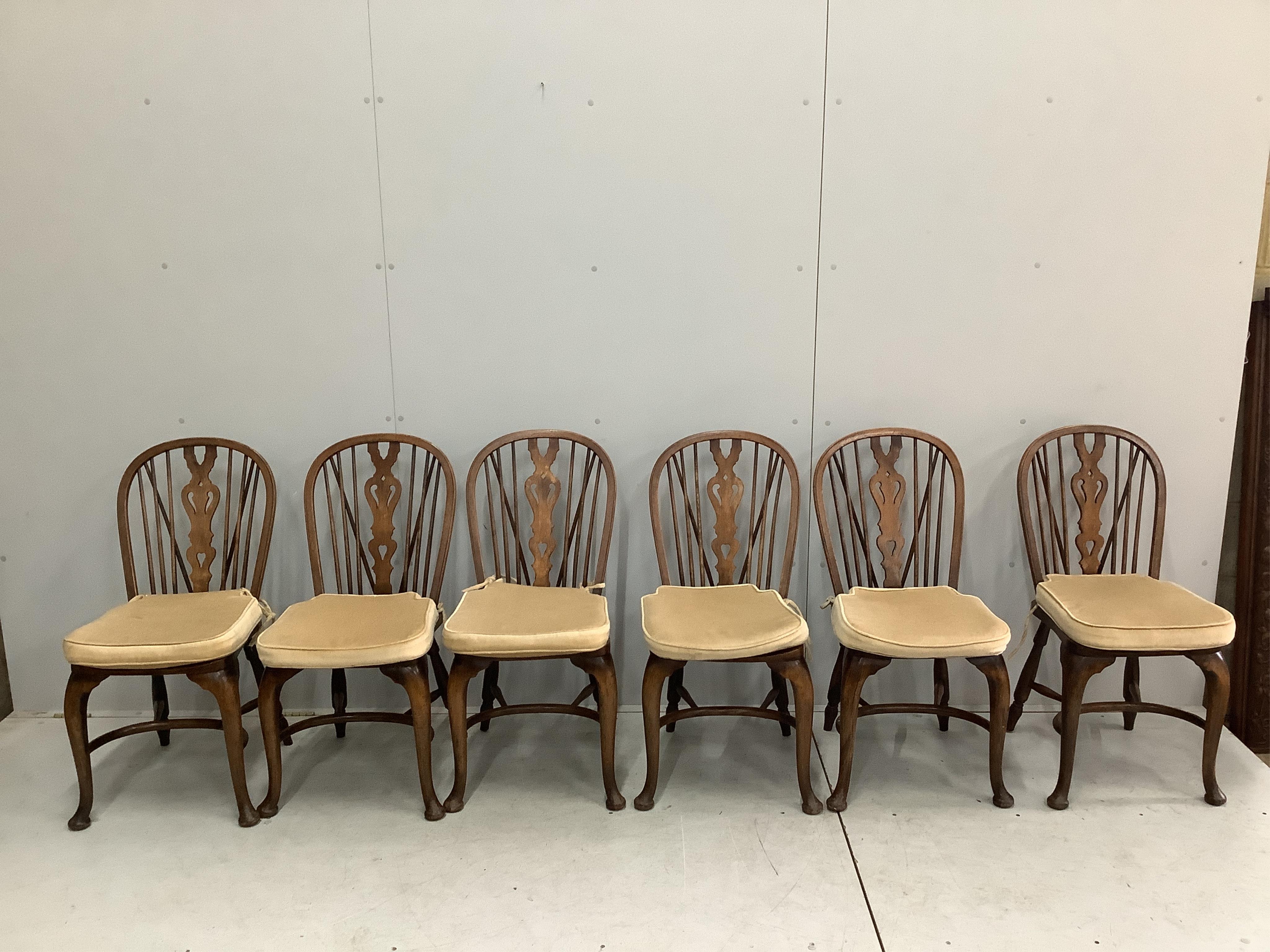 A set of eight reproduction elm and beech Windsor cabriole leg chairs, two with arms. Condition - fair